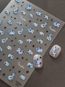 Macro detail of 3D watercolor blue pumpkin and black star relief nail art stickers