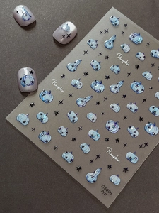 Macro view of blue pumpkins and black star nail stickers for Halloween and autumn theme