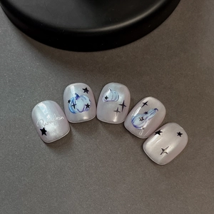 Handmade Halloween pearl purple press-on nails featuring pumpkin and star designs