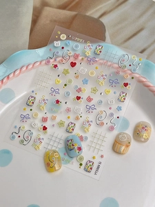 Detail of cute 3D bear and button nail art stickers with macaroon color DIY tips