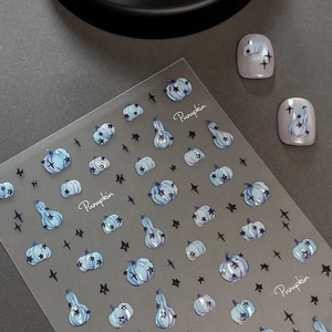 Holographic Halloween pumpkin nail stickers with blue-grey star designs on grey background