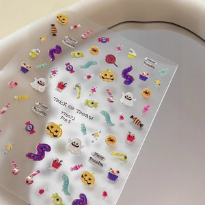 Halloween nail art stickers with colorful pumpkin and ghost designs on a clear sheet