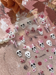 5D embossed nail stickers featuring romantic gothic skulls and roses on textured paper