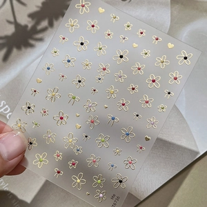 Cute gold stamped floral nail stickers with colorful dots and bow tie patterns