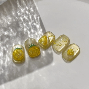 3D embossed pineapple nail stickers with yellow flowers and golden glitter on white background