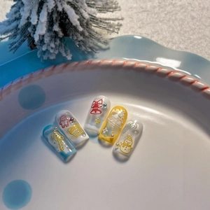Embossed Christmas nail stickers with cute reindeer, trees and snowmen on a blue plate