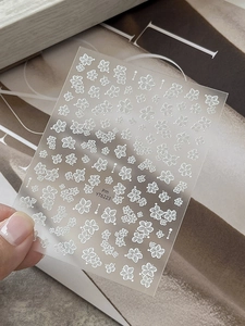 Detailed macro view of YT6223 semi-transparent nail art stickers with white floral motifs