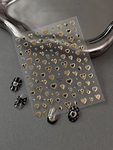 Detail of YT6712 gold 3D heart nail stickers with checkered and radiant patterns