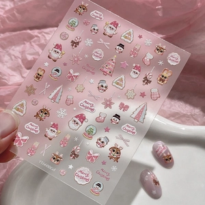 Jelly pink Christmas nail art stickers featuring cartoon Santa, reindeer, and snowflakes