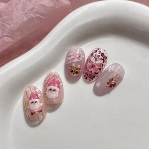 Jelly pink Christmas nail stickers featuring Santa Claus, reindeer, and bow decorations