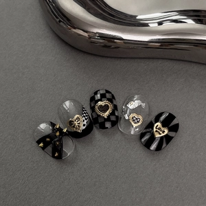 Gothic gold heart nail stickers with black checkerboard and cross rivet designs
