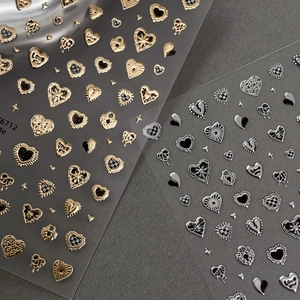 Gold and silver embossed heart nail stickers with checkered and love lettering patterns