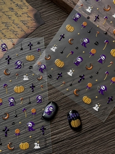 Detail of 5D embossed Halloween nail stickers with Grim Reaper and pumpkin designs