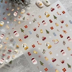 Christmas nail art stickers with 3D embossed Santa, reindeer and snowflake patterns