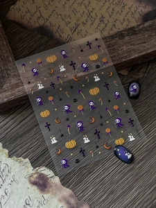 Detail of Halloween nail art stickers with 5D embossed grim reaper and pumpkin patterns