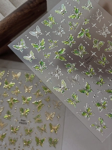 Close-up of holographic butterfly nail stickers with star patterns YT6377 and YT6373