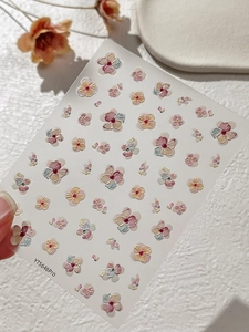 Detail view of 5D embossed pansy floral nail stickers with textured 3D petal designs
