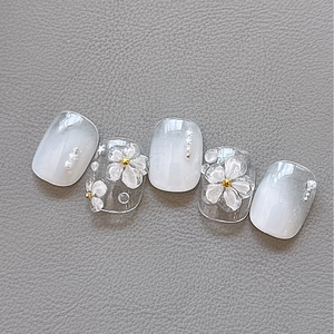 Short square floral press-on nails with 3D white flowers and pearl accents on white base