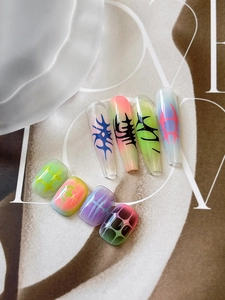 Detailed view of Y2K style gradient nail stickers with tribal lines and star patterns