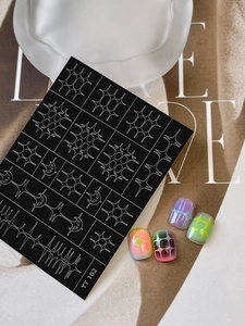 Detail view of cyber punk nail stickers with white star patterns and YT102 product tag