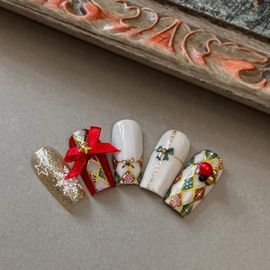 Christmas checkered nail art stickers with gold foil, 3D bows, and snowflakes design