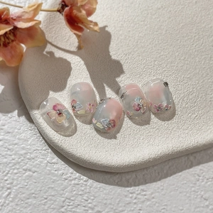 Embossed floral press-on nails set with 3D flower art and rhinestone embellishments