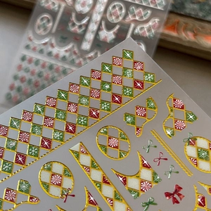 3D embossed Christmas nail art stickers with gold foil checkered patterns and snowflakes