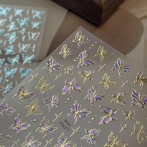 Golden starlight butterfly nail art stickers with purple gradient and star accents