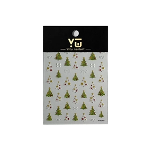 Stickers à ongles 3D en relief avec sapin de Noël et flocons sur fond blanc