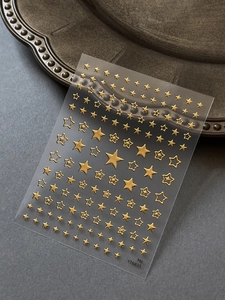 Macro d'autocollants étoiles dorées pour ongles avec texture 3D et motifs d'étoiles creuses