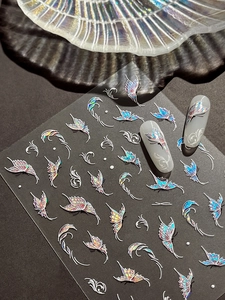 Macro shot of laser butterfly nail stickers with iridescent holographic vine patterns