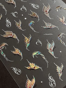 Detailed macro view of 5D embossed butterfly nail stickers with holographic laser finish