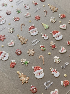 3D embossed Christmas nail stickers featuring Santa, snowman, and gingerbread man icons
