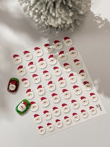 Stickers 3D Père Noël en relief pour ongles appliqués sur manucure de fête verte