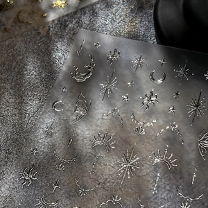 Silver metallic nail art stickers featuring celestial moon and star embossed designs