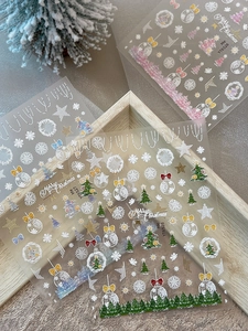 Detail of Christmas nail art stickers featuring gold snowflakes and trees YT6526