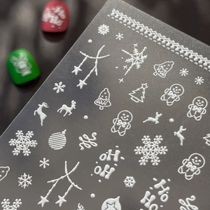 White 3D embossed Christmas nail art stickers featuring snowflakes and reindeer patterns