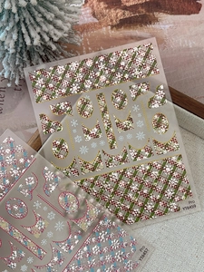 Close-up of embossed gold Christmas snowflake and plaid nail art stickers YT6459 YT6457