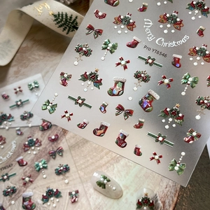 3D Christmas nail stickers featuring bows, stockings, and trees with pearl accents