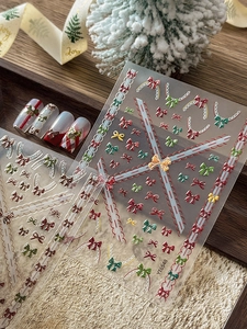 Détails des autocollants ongles 3D YT6548 avec nœuds rouges et dentelle dorée de Noël