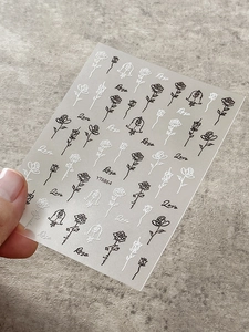 Detail view of embossed black and white rose nail art stickers with model YT6864 labels