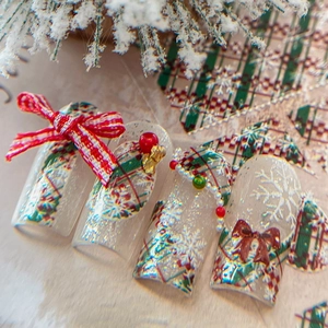 Christmas press-on nails with red plaid, 3D bows, gold bells and white snowflakes