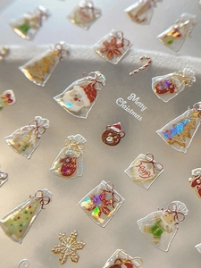Macro shot of 3D embossed Christmas nail stickers with iridescent laser snowflake designs