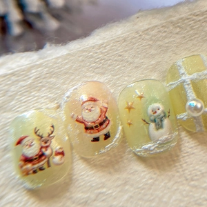 Embossed Christmas nail stickers with Santa Claus, reindeer, and snowman designs