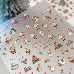 Embossed Christmas nail art stickers featuring Santa, snowman, and holiday patterns