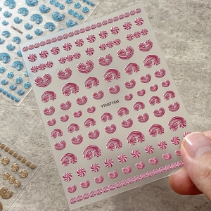3D embossed cream spiral nail art stickers in pink and blue for manicure decor