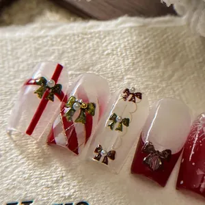 Stickers ongles de Noël avec nœuds et flocons de neige, motifs festifs rouges et blancs