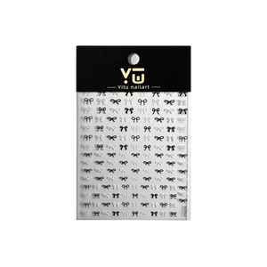 Embossed bow nail art stickers in black and white styles on minimalist packaging