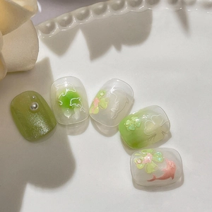 Sweet jelly dolphin and clover press-on nails with pearl accents and green shimmer finish