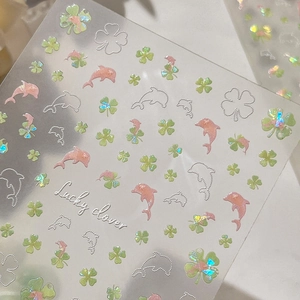 Iridescent aurora shell clover and dolphin nail art stickers with lucky clover pattern